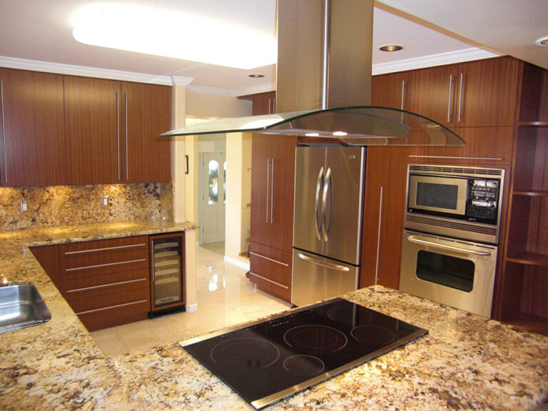 Golden Persa stone countertop with stovetop in kitchen.